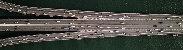 Aerial view of bridge with cars crossing